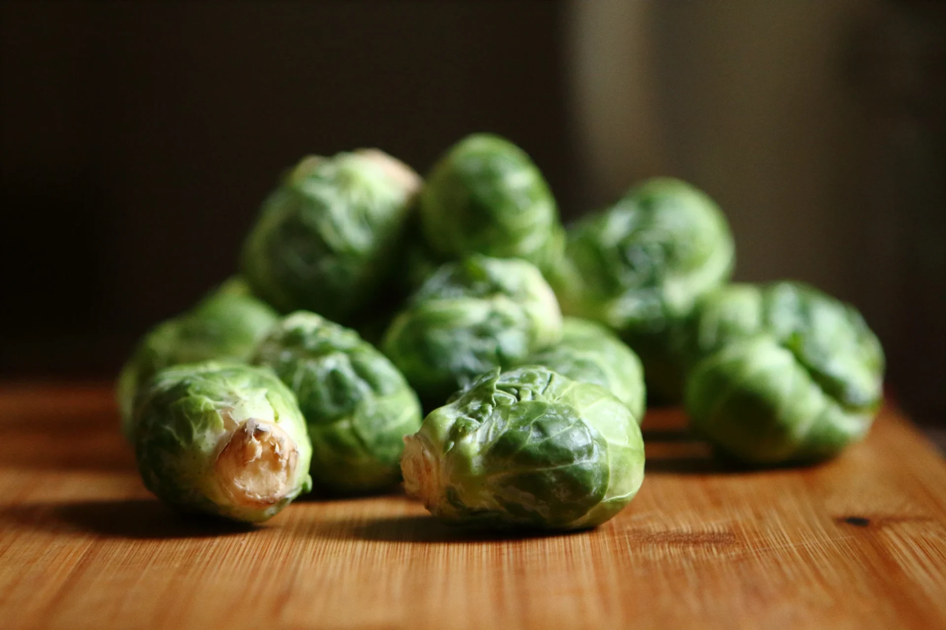 close up of brussels sprouts on stem in outdoor garden